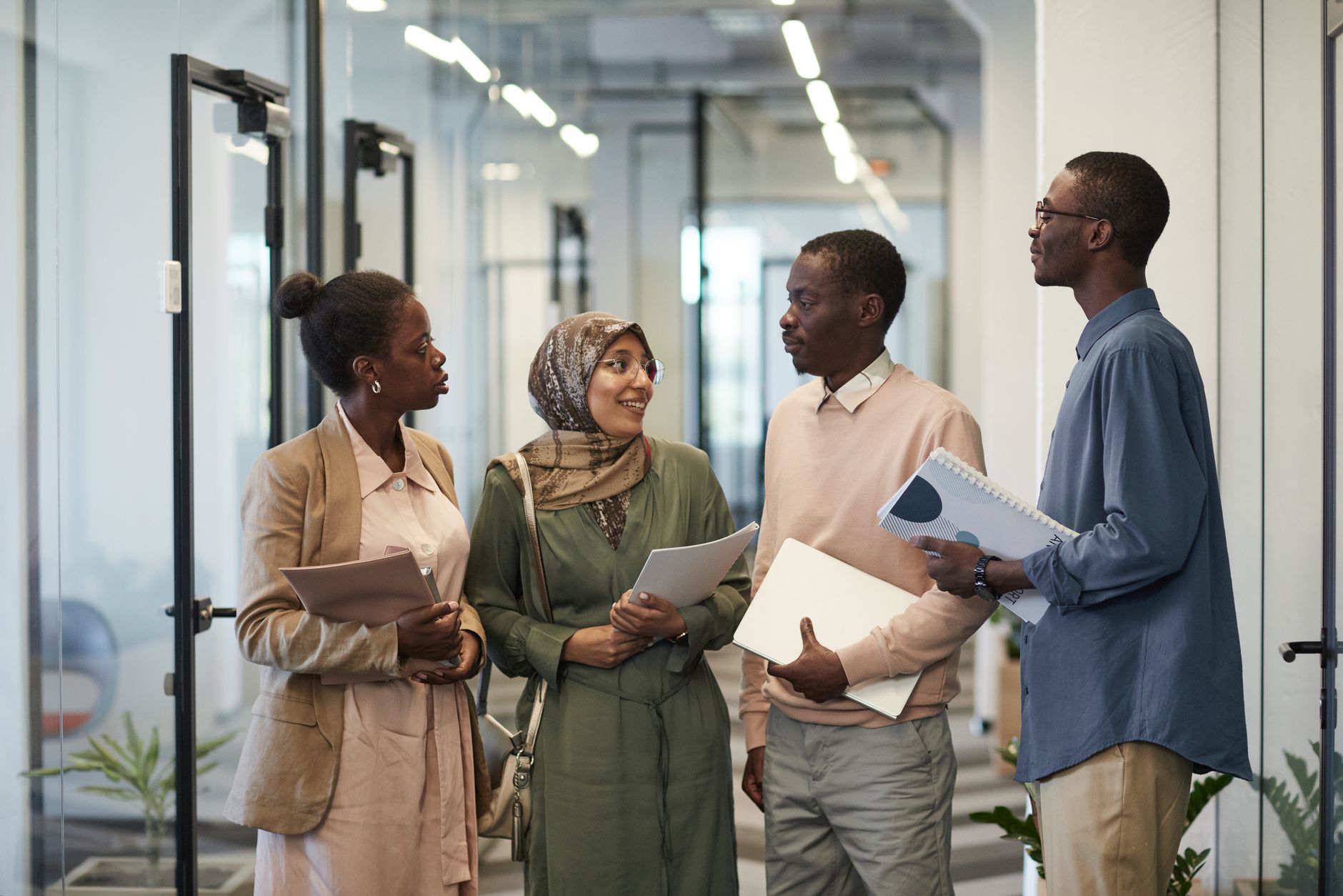 Colleagues talking together in a workplace